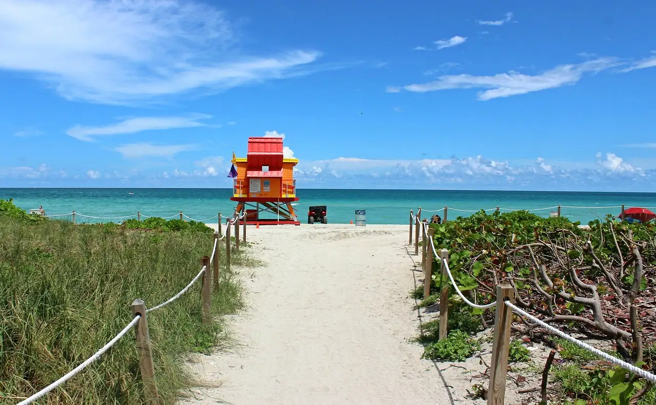 A sandy path through the dunes to a lifeguard tower on Miami Beach