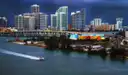 A boat crossing Biscayne Bay in front of the Miami skyline