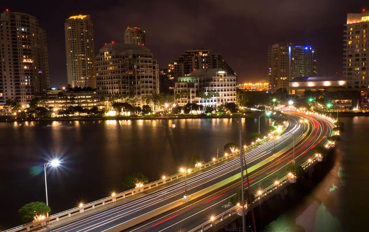 The Brickell skyline and causeway lit up at night