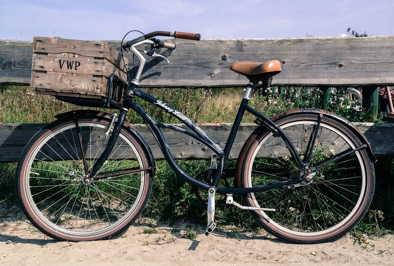 A black cruiser bicycle with wide handlebars