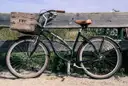 A black cruiser bicycle with wide handlebars