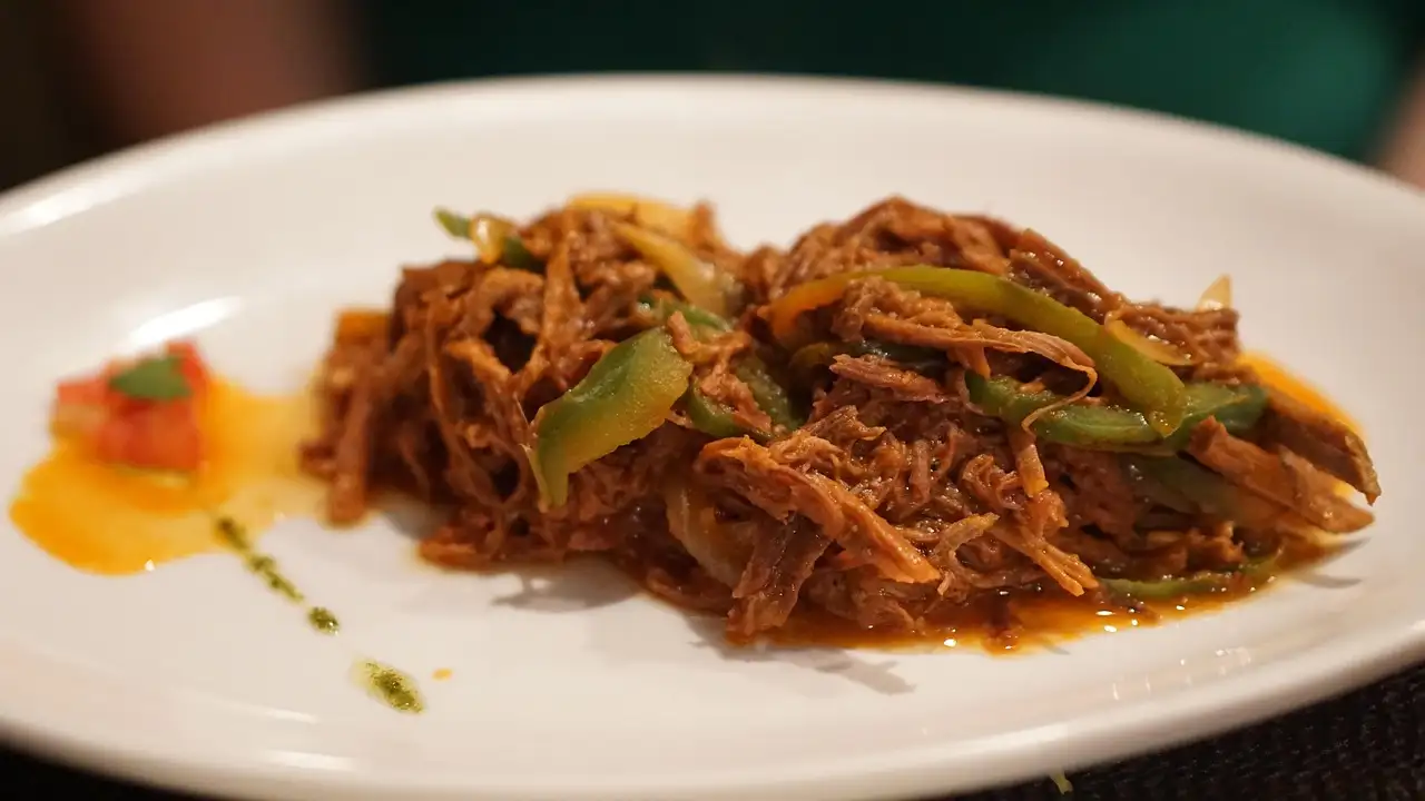 A plate of ropa vieja, Cuban shredded beef with peppers