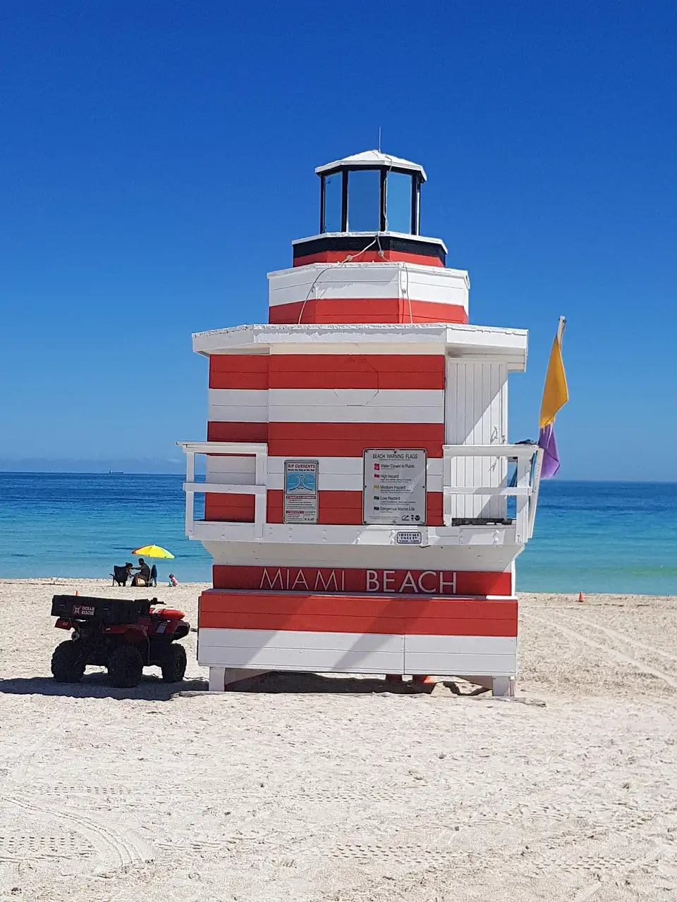 Red and white striped lifeguard tower on a Miami Beach shore