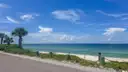 A Florida Keys shore road with palms and turquoise sea