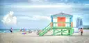 Colourful lifeguard stand on South Beach with swimmers on the sand