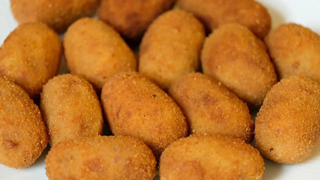 A plate of golden fried croquetas
