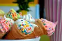 Ice cream cones covered in sprinkles