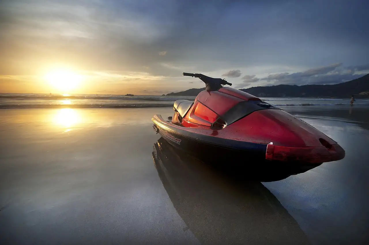 A jet ski floating in low sunlight