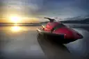 A jet ski floating in low sunlight