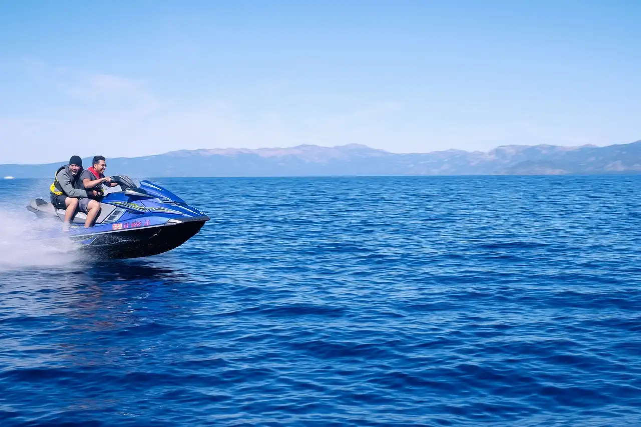 A jet ski speeding across deep blue water