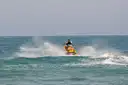 A jet ski far out on calm sea