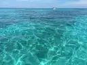 Clear turquoise water over the reef at Looe Key in the Florida Keys, with a boat beyond