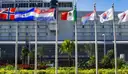 Entrance of Miami International Airport with a row of national flags
