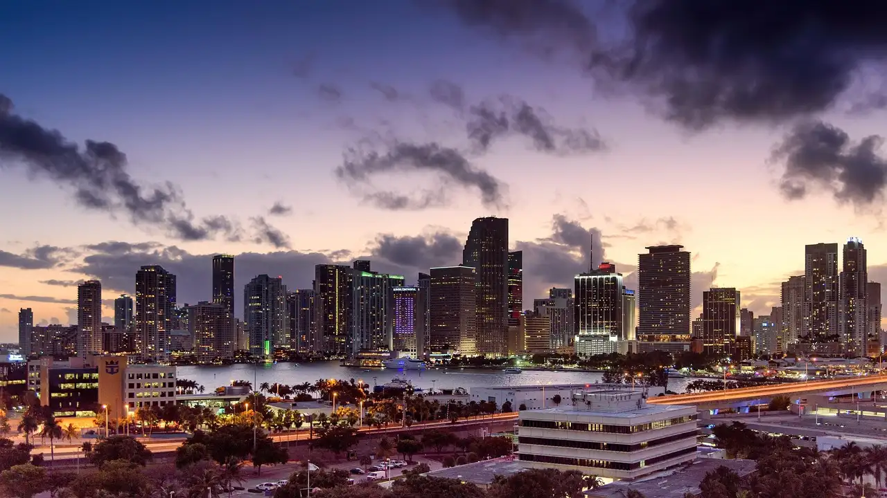 Downtown Miami skyline at dusk with the city lights coming on