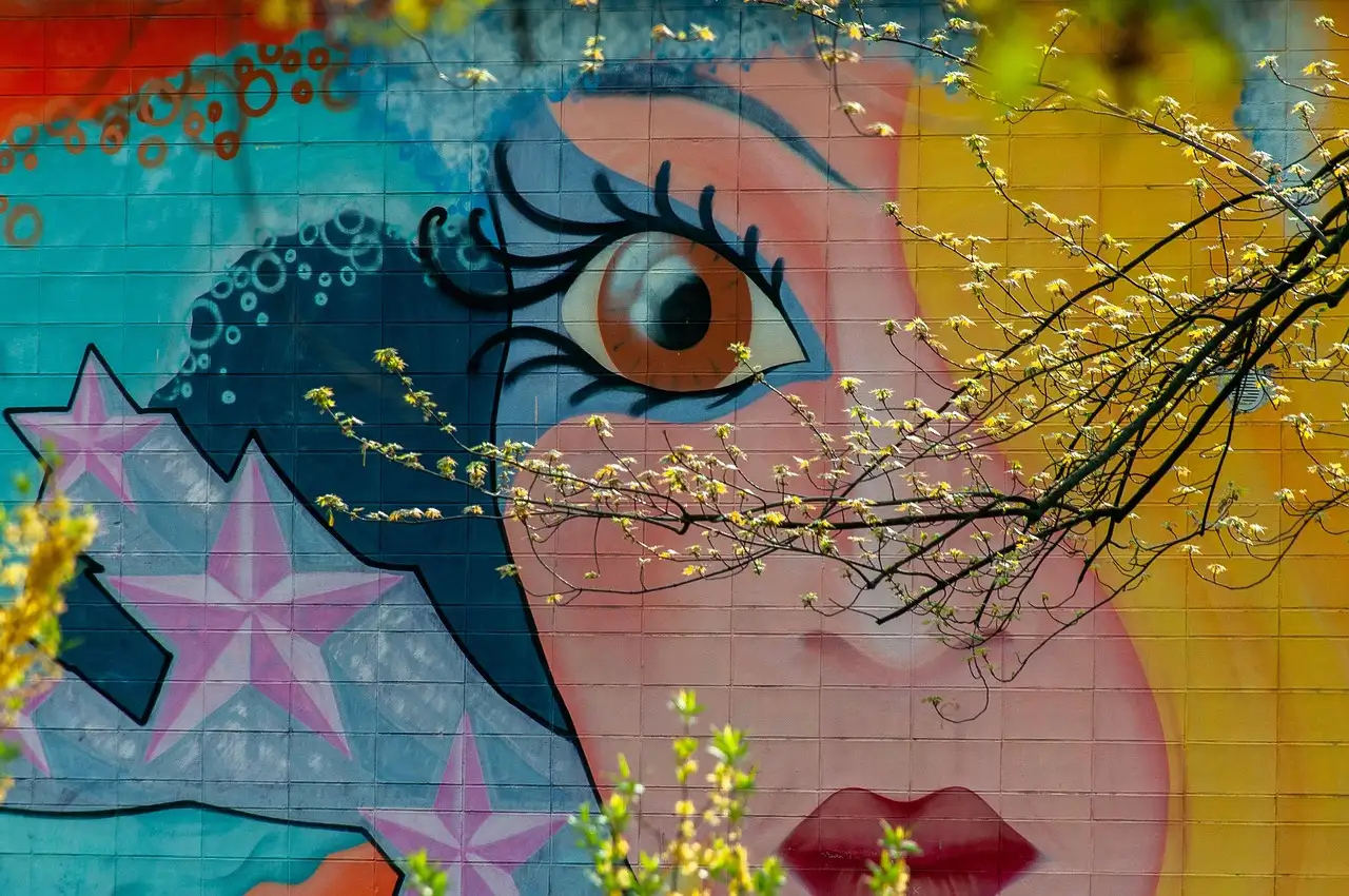 A colourful mural of a large eye and stars