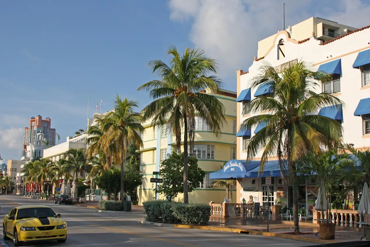 Ocean Drive in Miami Beach: pastel Art Deco hotels and palm trees on a sunny day