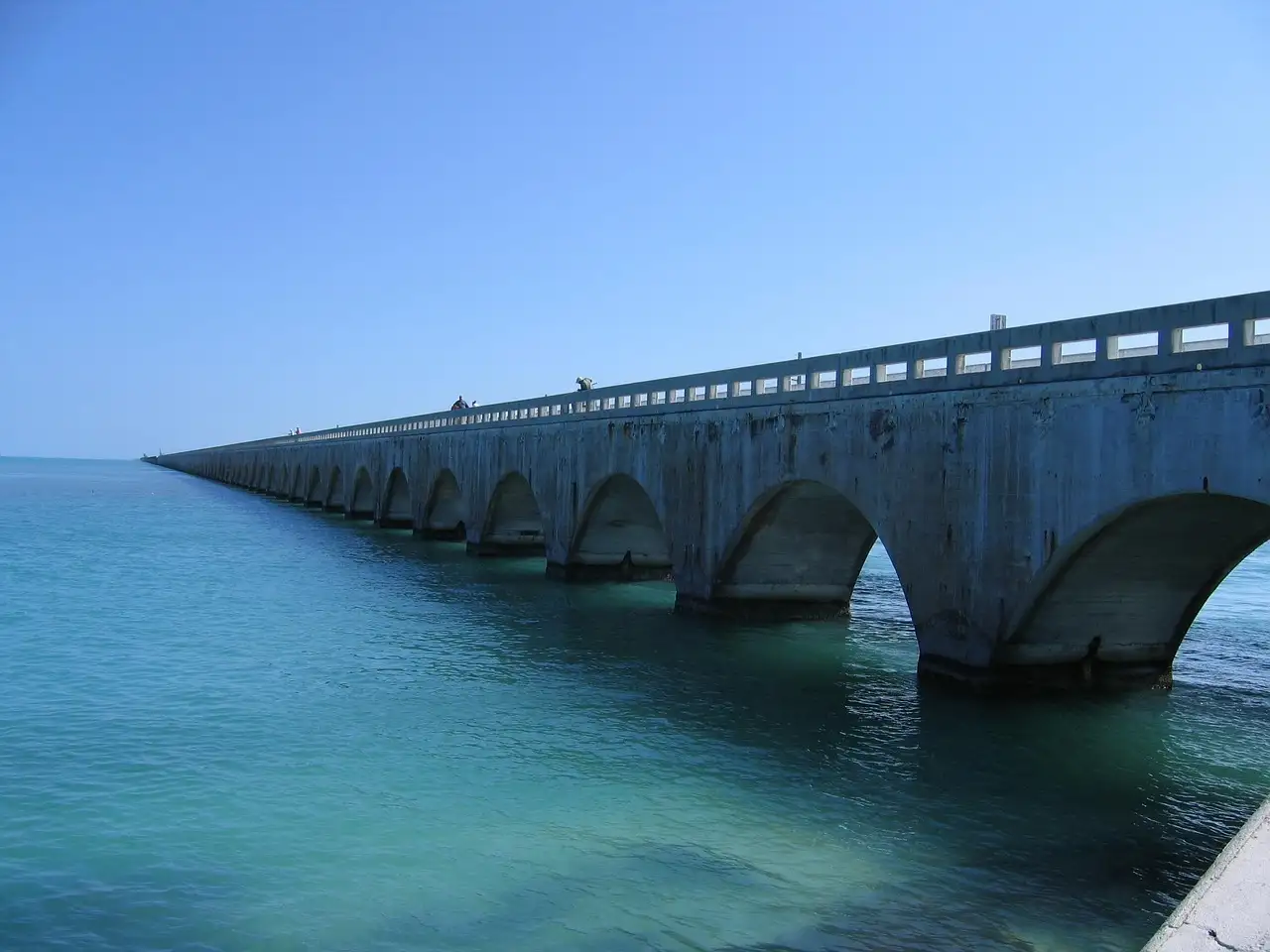 The arches of the old Seven Mile Bridge over turquoise water
