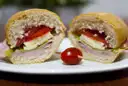 Two halves of a toasted sandwich with tomato