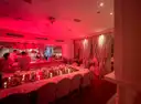 Candlelit dining room with set tables at a Miami Beach restaurant