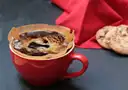 A small strong coffee in a red cup