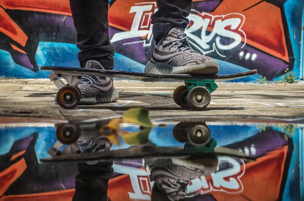 Skateboard and colourful graffiti mural in Miami street art district