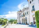 Sunlit white facade of Vizcaya Museum and Gardens in Miami