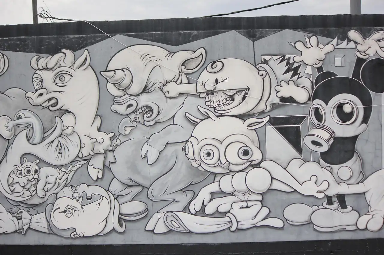 A black-and-white cartoon mural on a street wall in Wynwood