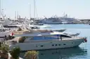 Motor yachts moored in a sunny marina