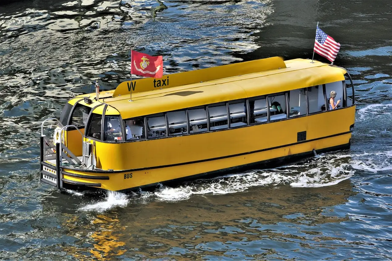 A yellow water taxi on the water