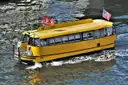 A yellow water taxi on the water